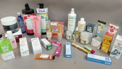 many different types of skin care products laid out on a table