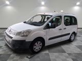 the white van is parked on a checkered floor in a room