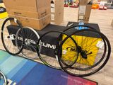 two bikes that are sitting on the floor next to each other