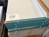 several stacks of boxes of white and blue boxes sitting on top of a pallet