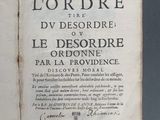 an old book with writing on it sitting on a table