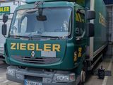 a truck that is parked in front of a building