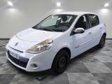 a picture of a small white car parked in a garage
