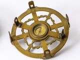 an image of a brass compass on a white background
