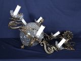 a crystal ball with candles on a chain on a blue background