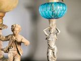 two statues that are sitting next to each other on a table