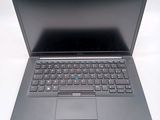 a laptop computer with a keyboard on a white surface