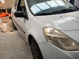 a white car that is parked in a garage