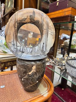 a vase that is sitting on a table in a store
