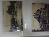two old photos of a city on display on a shelf