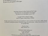 an open book with a poem on it sitting on a table