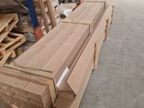 a large amount of boxes stacked on the floor in a warehouse