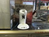 a coffee maker sitting on a counter in a store