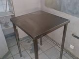 a small table that is in the corner of a room