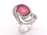 a close up of a pink stone and diamond ring on a white background