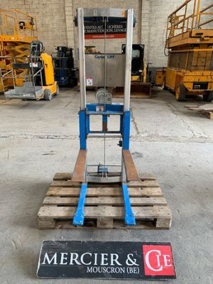 a close up of a fork lifter in a warehouse