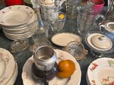 a table with a lot of dishes and cups on it