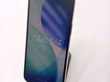 an image of a close up of a cell phone on a stand
