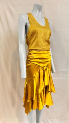 the mannequin is wearing a yellow dress with ruffles on it