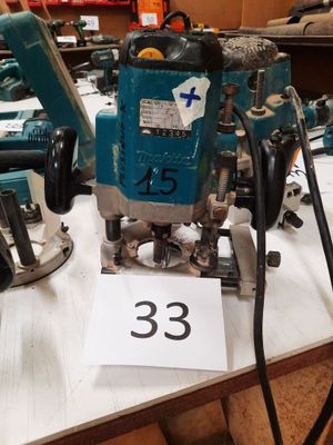 two electric tools on a table with a price tag on it
