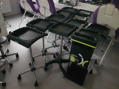 purple and white chairs in a room with a desk and a chair