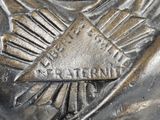 a close up of a statue of a man with a sword