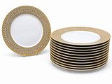a set of six gold and white dinner plates