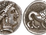 a silver coin with an image of a man on a horse