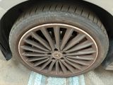 a car with a flat tire on the street
