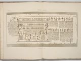 an open book with a drawing of egyptian writing on it