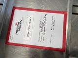 a red and white ticket on a metal table
