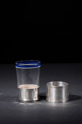 a shot glass and a shot glass sitting on a table