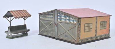 a small model of a building and a bench