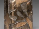 a close up of a metal object with a bird on it