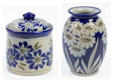 two blue and white vases with flowers on them