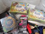 a lot of toys and games in a plastic bag