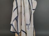 white and blue scarf on a mannequin head on a mannequin dummy