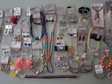 a lot of necklaces hanging on the wall