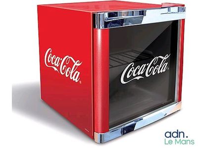 a small red coca cola cooler with the word coca written on it