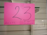 a pink sign with the number 23 written on it