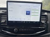 a car dashboard with a monitor and a radio in it
