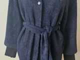 an image of a blue coat on a mannequin