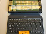 a laptop computer sitting on a table with a price tag on it