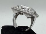 an image of a diamond ring on a black velvet stand