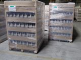 several pallets of bottled water are stacked on pallets in a warehouse