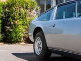 a silver car parked on the side of the road