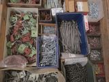 many different types of screws and nails in a box