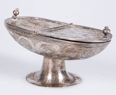 a silver bowl with a lid on a stand