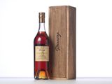 a bottle of wine sitting next to a wooden box