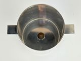 an image of a metal pot on a white surface